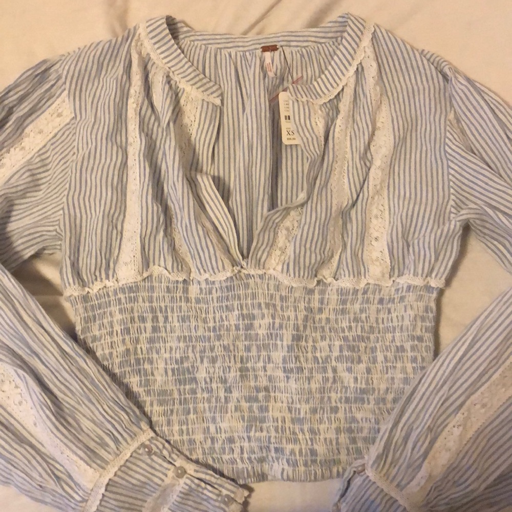 Blue and white striped cropped long sleeve top